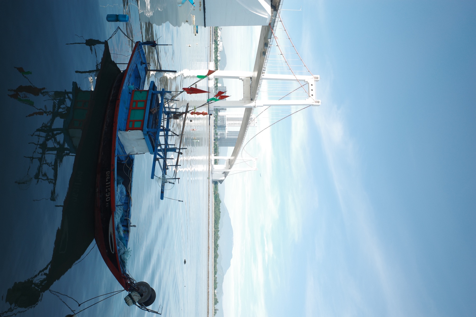 Fishing boat below the bridge